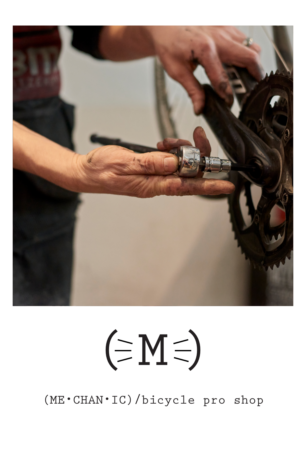 A picture of a hand holding a tool to remove a bicycle crank arm.