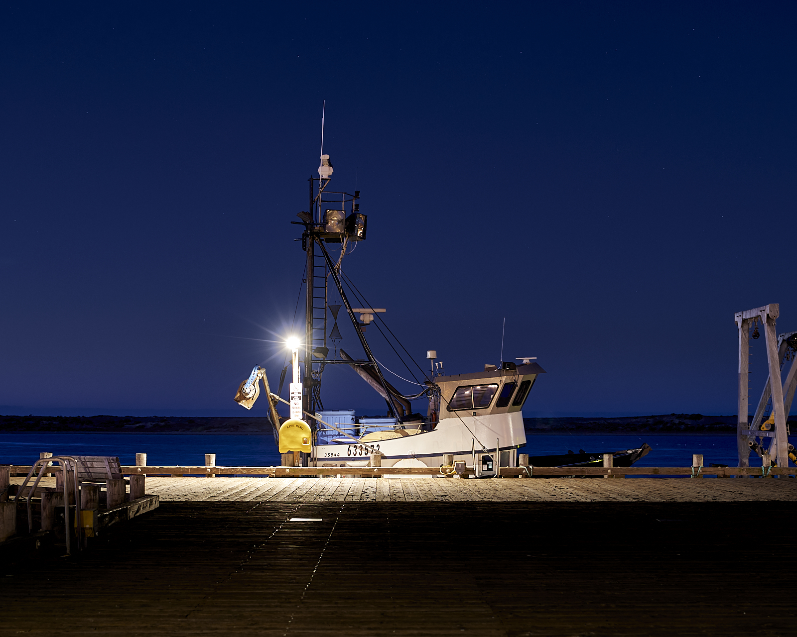 Urban #181230.1. A photograph of a boat docked in the predawn gloom.