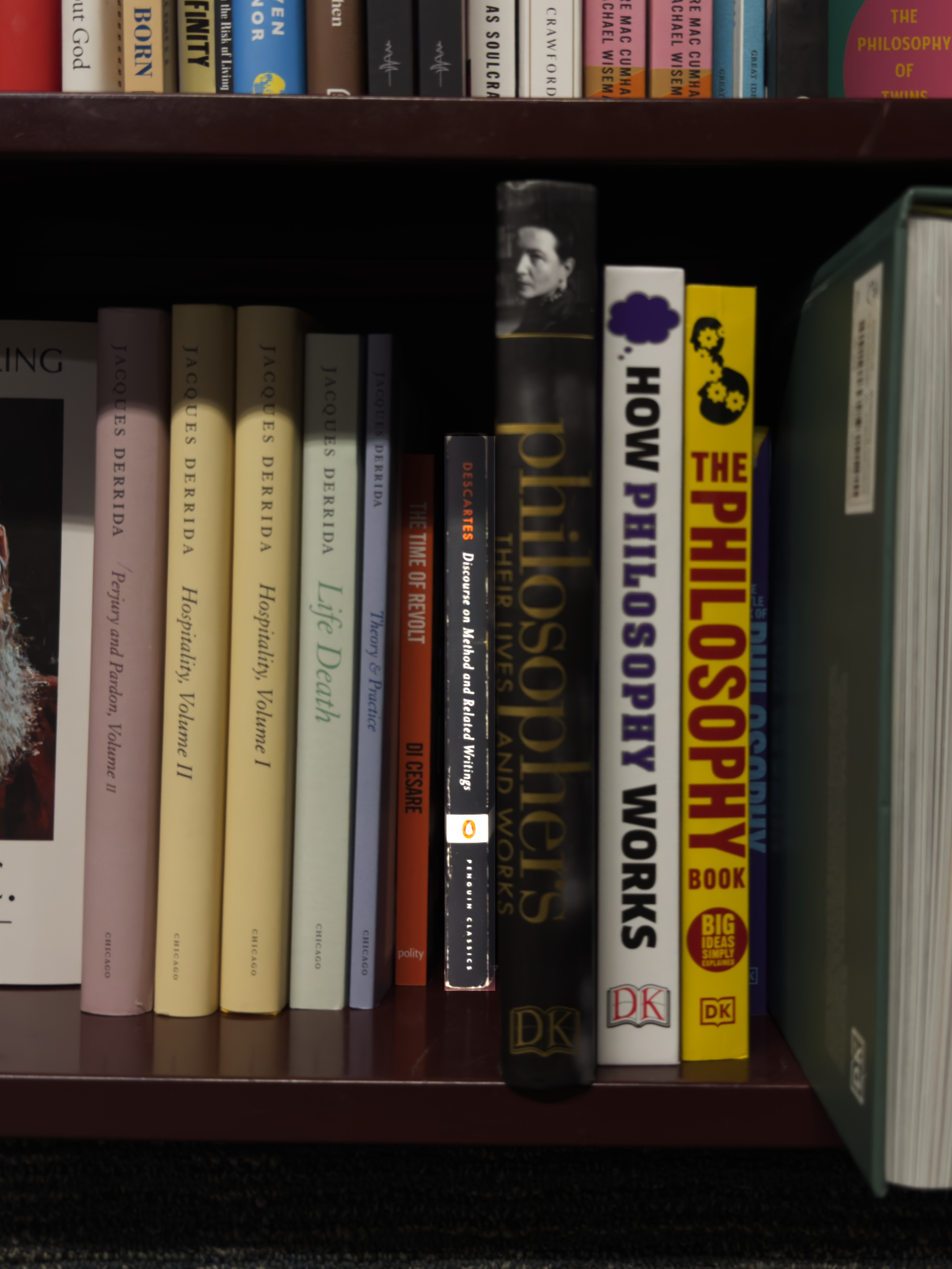 A photograph of a shelf of books, with Descartes’ “Discourse on Method” highlighted.